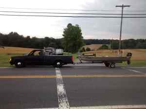 GMC S15 towing jon boat.