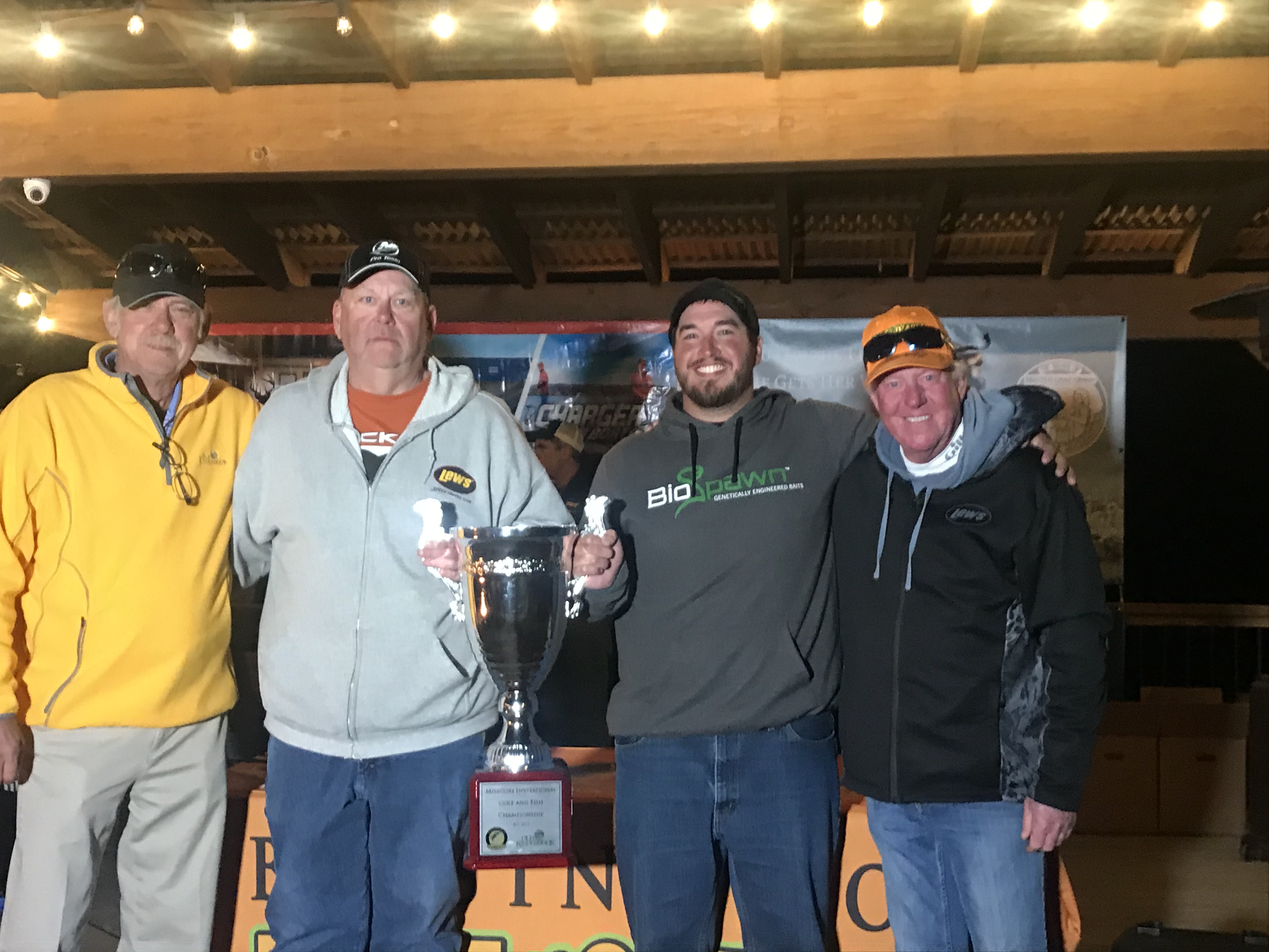 Chris Bridges (middle left) and Andy Newcomb (middle right) won the Bassing Bob Missouri Invitational Pro-Am Fishing and Golf Championship at Lake of the Ozarks. Presenting the championship trophy to the winners are Missouri Invitational co-founders Bob Renken (far left) and Bassing Bob Bueltmann (far right).