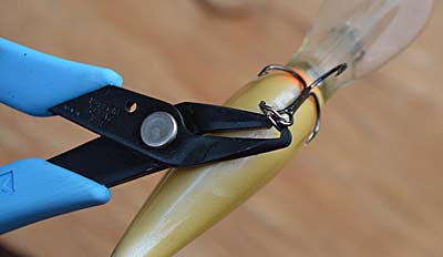 Carefully inspect the hooks on your lures. Replace any that are bent. Try sharpening dull ones with a few passes of a fine file. Photo by Pete M. Anderson