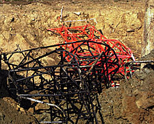 Sprint car frames, deposited from the yard into the lake, nudged nicely in a trench, to attract fish.