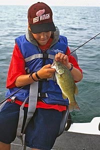 Matt Gnatkowski works to unhook a big-lake bass.