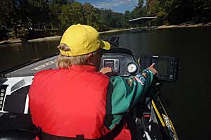 Tim Horton makes manual adjustments to get the clearest and most accurate images on his electronics.