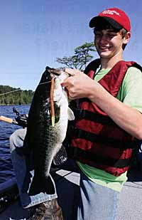 Nathaniel Samsel holds a hearty largemouth bass caught in Richmond Mill Lake at King Fisher Society.