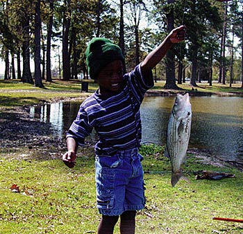 Child with hybrid striped bass