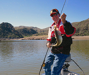 Gary Senft likes to fish creature baits like this Yum bait to locate bass that are eating craws displaced by changing water levels. As you can tell from this photo, the water at this lake is down (and falling) and Gary is fishing structure far from shore.