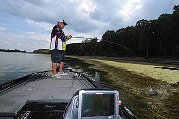 Bill Lowen catches bass in the grass by skimming a frog over the weed mat during the summertime.