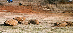 These rocks have been set aside to use as habitat in a pond which covers about two acres. The rocks will be stacked in water no deeper than eight feet, with the top of the pile about four feet deep. Sunfish will hide inside the crevices, bass will orient to the outside. Early on, fathead minnows will spawn on the rocks.