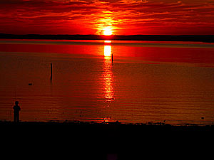 Kid fishing at sunset