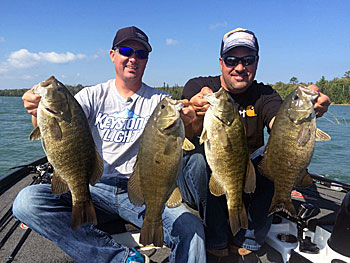 Bassmaster Elite Series angler Chad Grigsby heads shallow for smallmouth in autumn, when big smallmouth are tricked into trying to spawn by water temperature. It’s a pattern he and Mark Zona exploited while shooting a recent TV show. Photo courtesy of Chad Grigsby