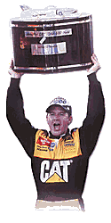 Ward Burton raises his 2002 Daytona 500 trophy in victory. (Photo by George Tiedemann/Sports Illustrated)