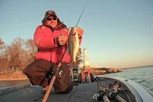 Mike McClelland holds a bass that fell victim to a McStick jerkbait. Most agree that a suspending jerkbait has won more late February and March tournaments than any other lure over the past 30 years on Grand Lake.