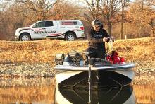 Mike McClelland unhooks a small Grand Lake largemouth inside a small pocket near the mid-region of Horse Creek.