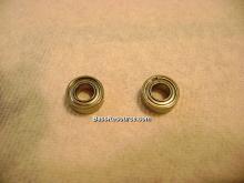 A stock bearing and an ABEC 7 stainless steel bearing. Can you see the difference? Neither can I. (click to enlarge)