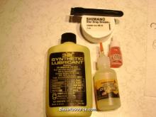 TSI 321, Ardent oil, Daiwa “red” oil, and Shimano drag grease. The brush, used to apply grease, is an electric shaver brush with the bristles trimmed short. Not pictured is 90wt gear oil. Unless specifically requested, these are all I use now. (click to enlarge)